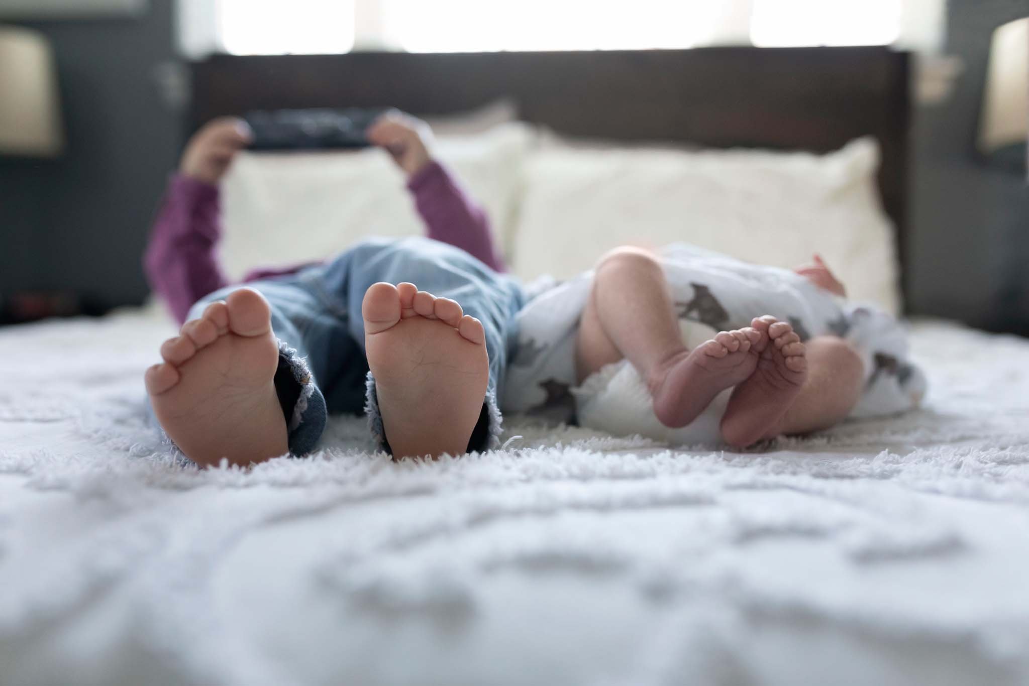 newborn photography baby and big sister feet