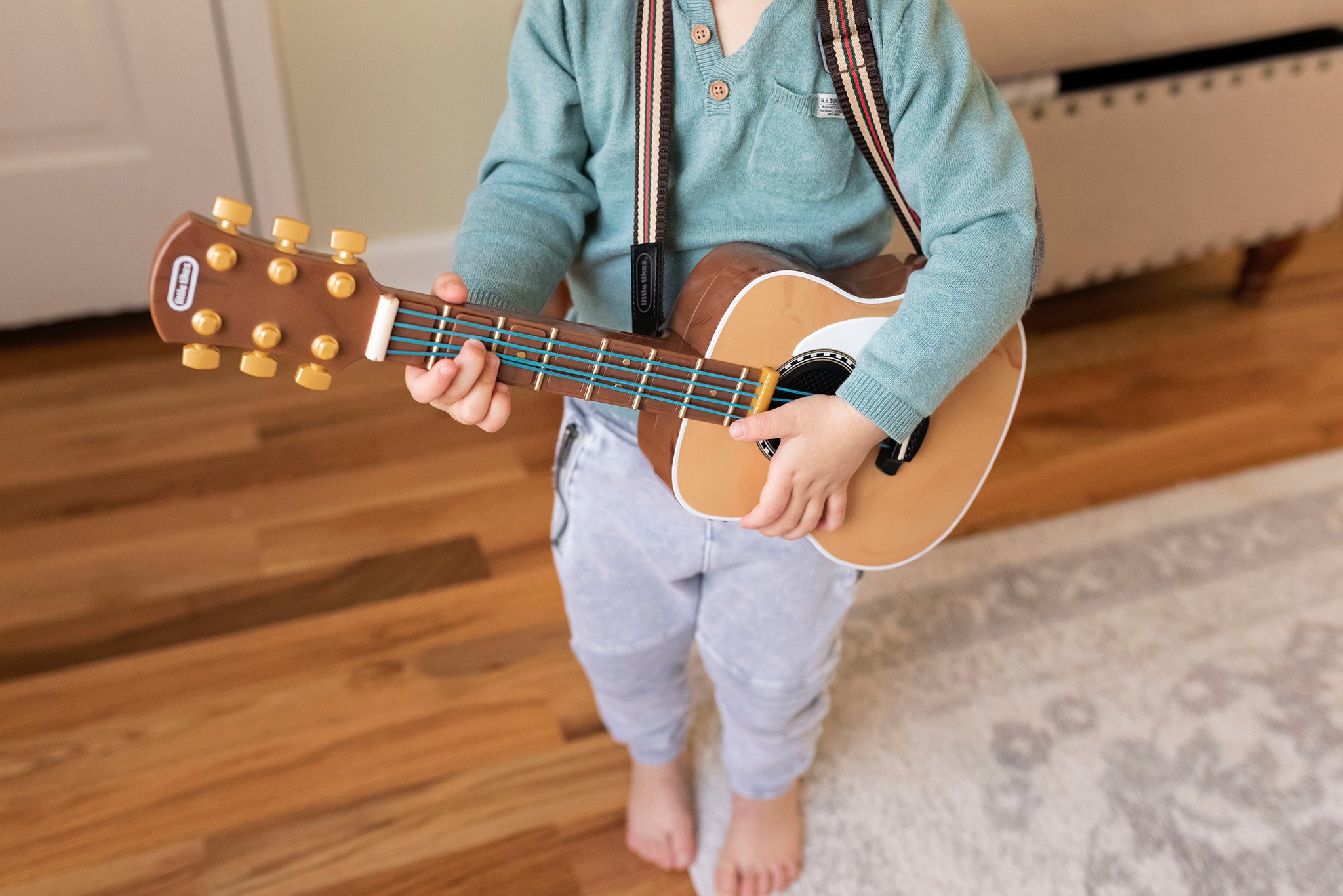 family photography boy playing guitar