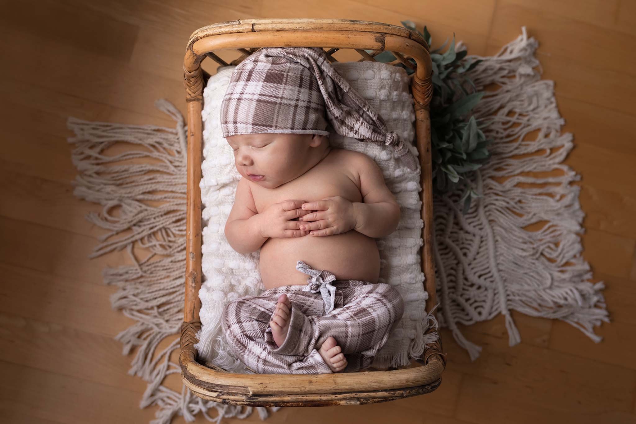 newborn baby sleeping in bed