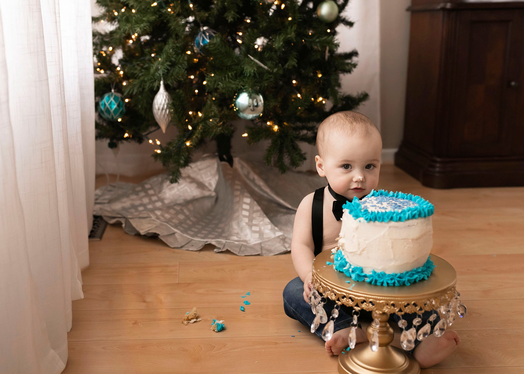 Birthday sits behind his first birthday cake smash cake I Cake Smash NJ