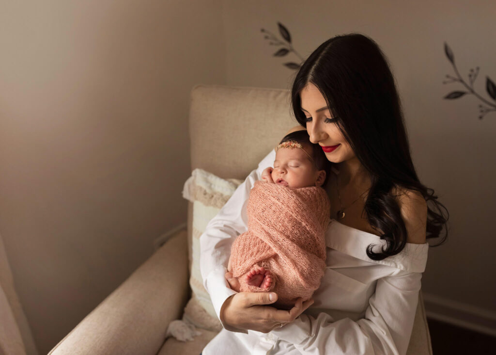 NJ Baby Photographer captures mom snuggling with her new baby.
