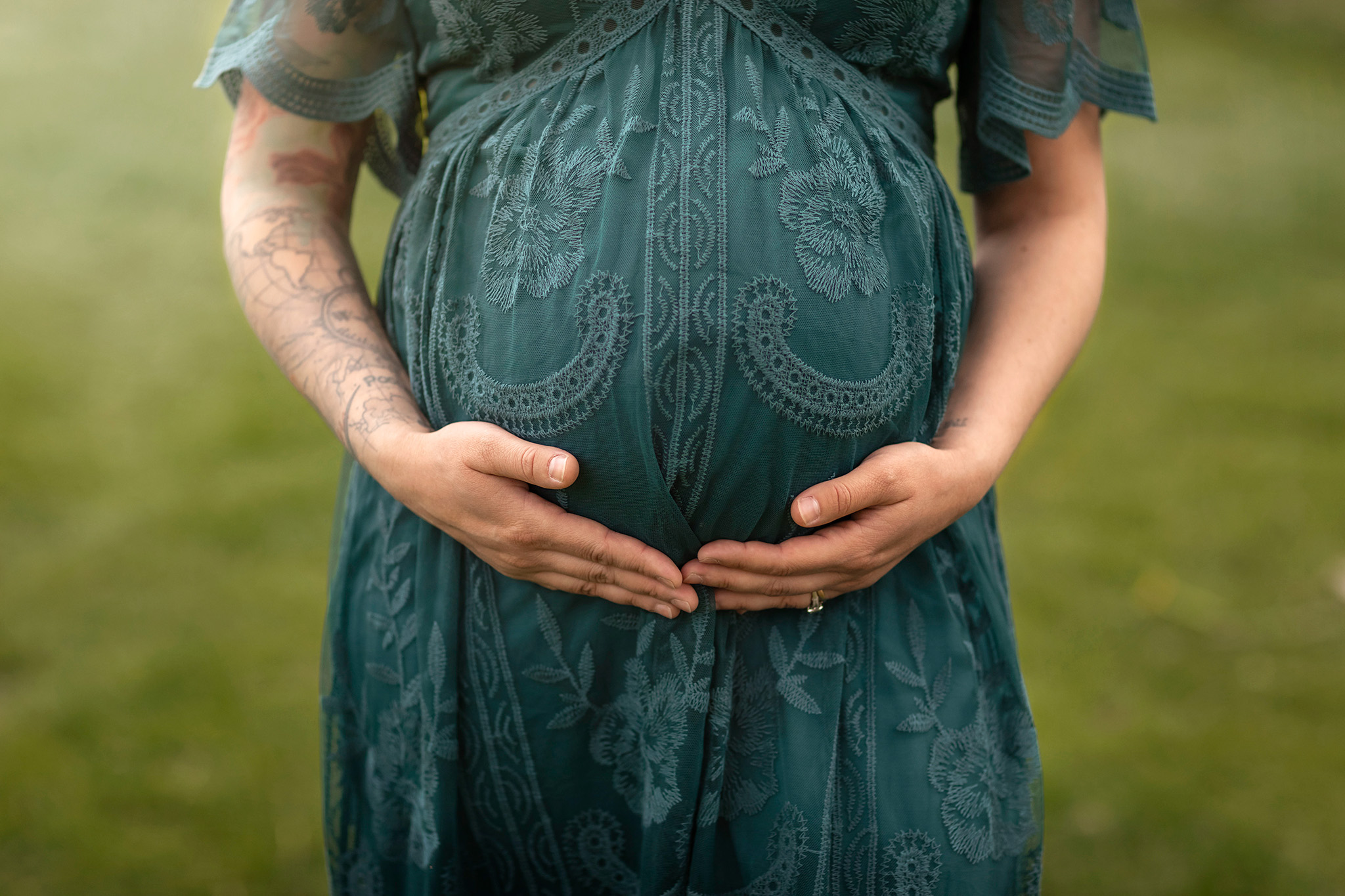 Expectant mom holds her belly I NJ Prenatal Massage