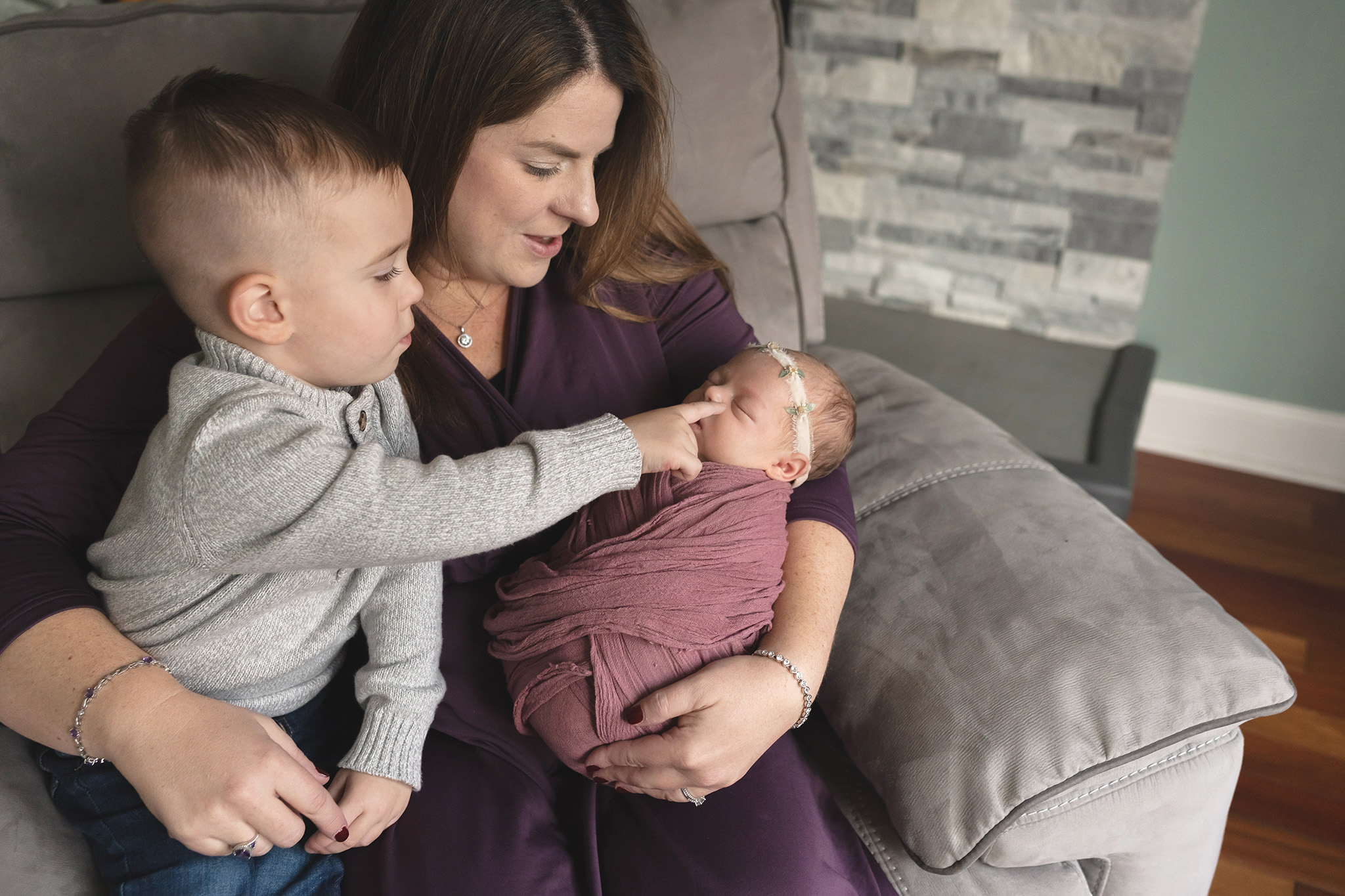 Mom holds her baby and her toddler at this NJ newborn session